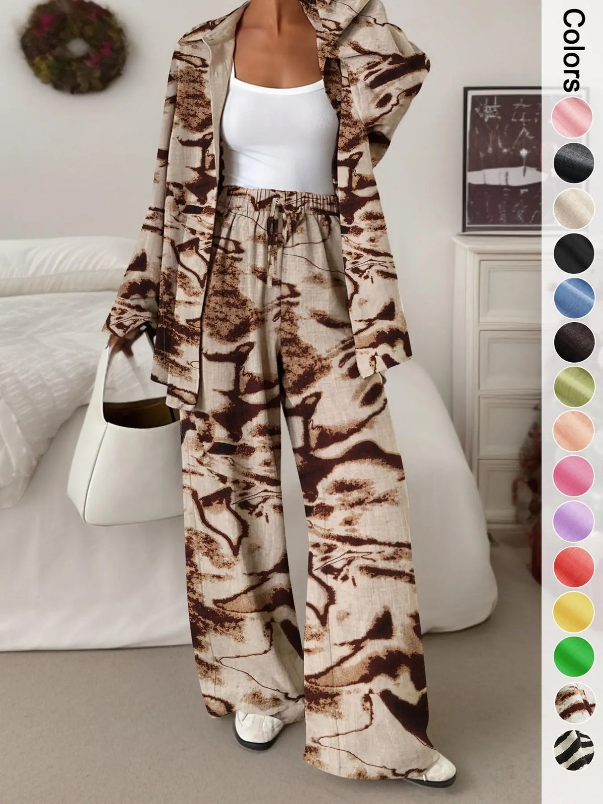 Women's casual athletic-style shirt and pants set—a two-piece ensemble featuring a loose-fitting button-down shirt and wide-leg pants, both comfortable and stylish