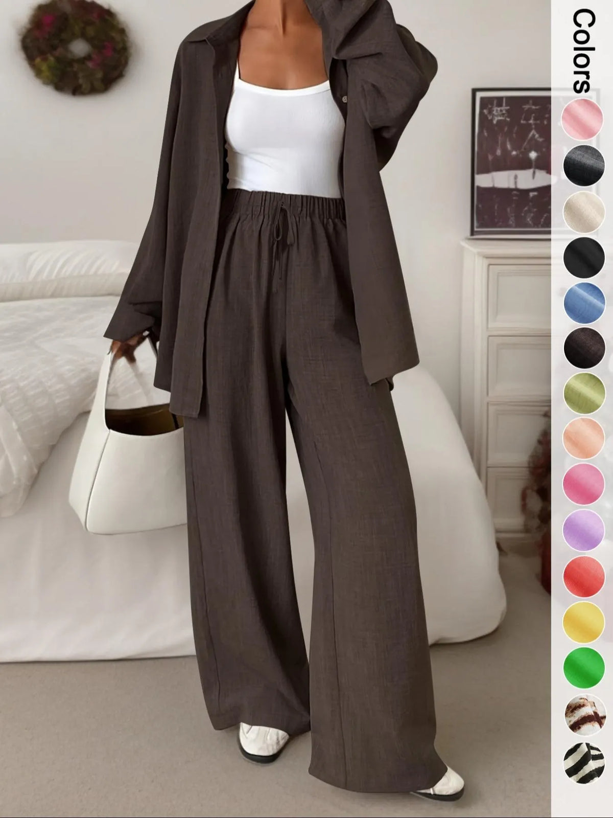 Women's casual athletic-style shirt and pants set—a two-piece ensemble featuring a loose-fitting button-down shirt and wide-leg pants, both comfortable and stylish