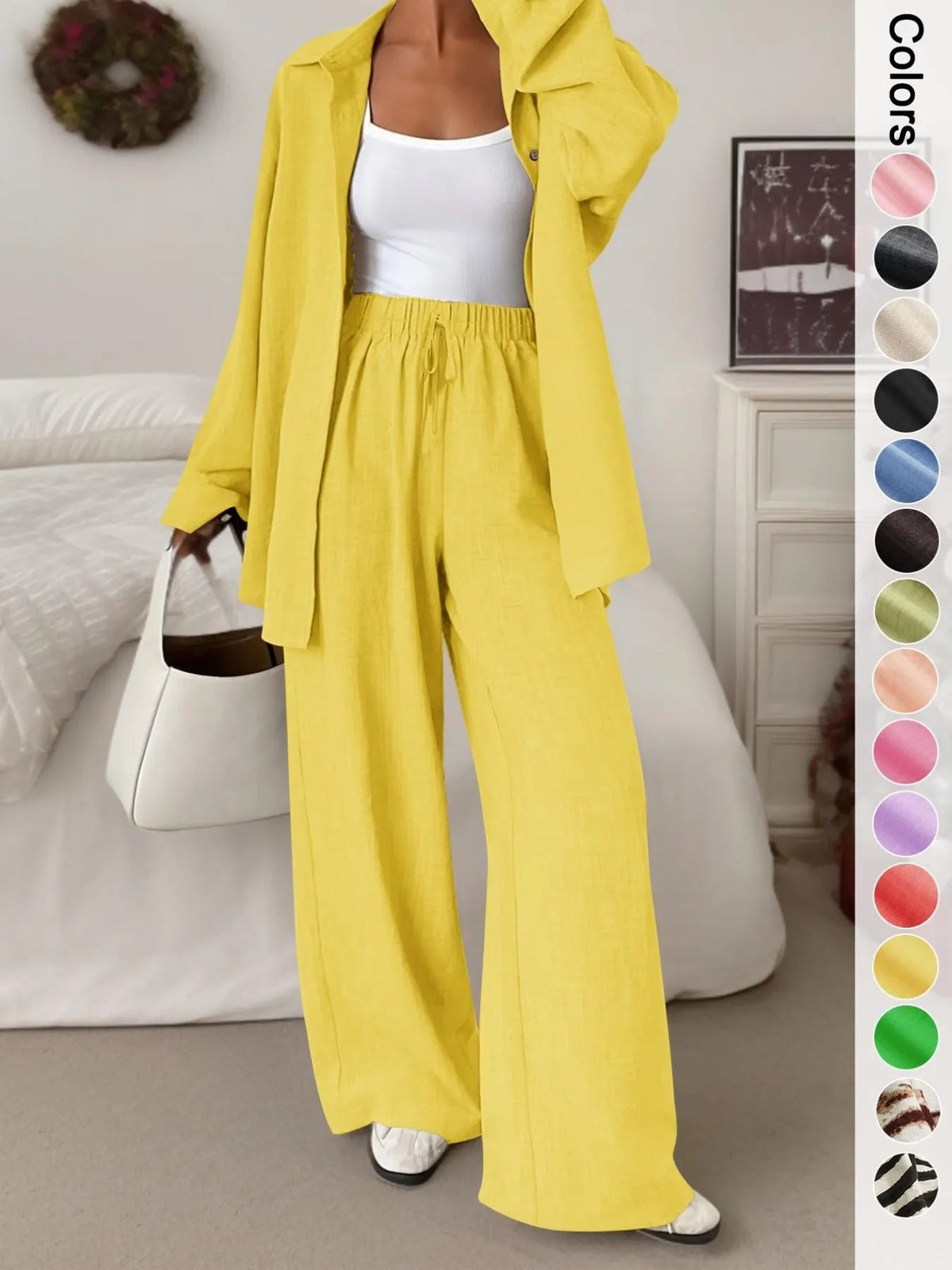 Women's casual athletic-style shirt and pants set—a two-piece ensemble featuring a loose-fitting button-down shirt and wide-leg pants, both comfortable and stylish