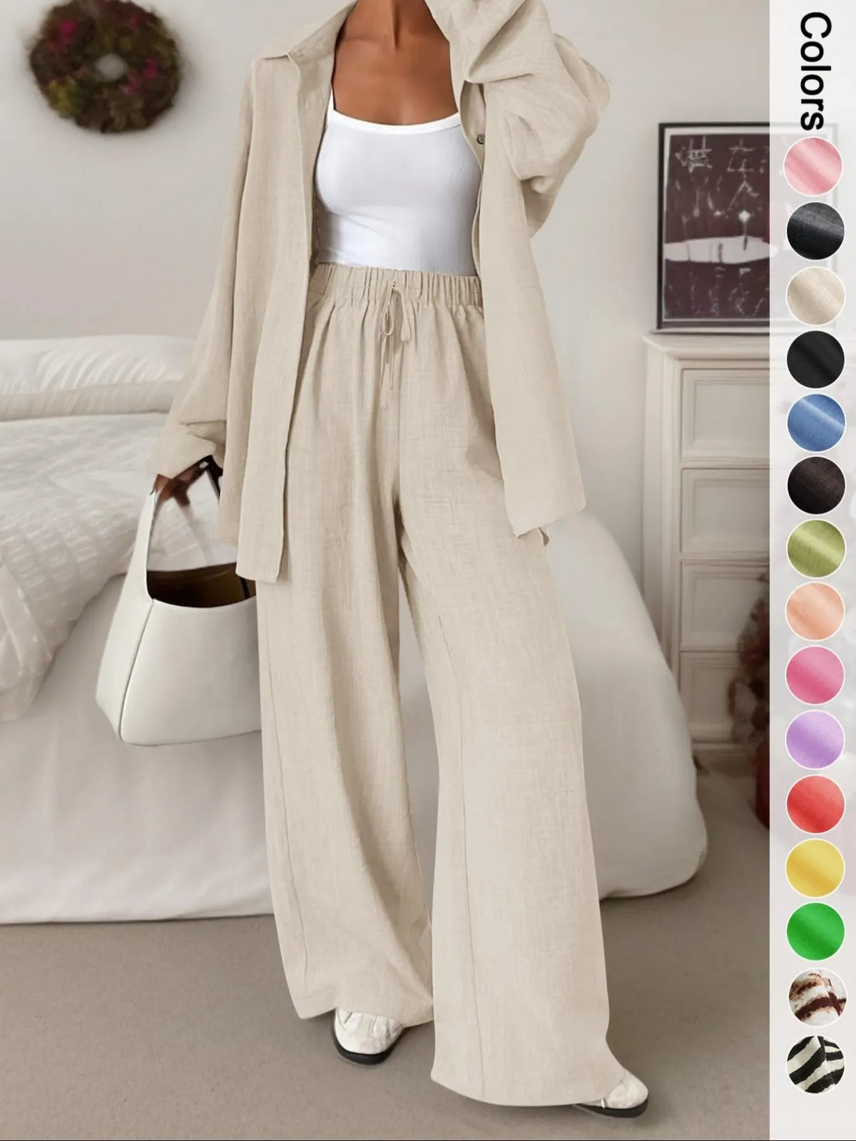 Women's casual athletic-style shirt and pants set—a two-piece ensemble featuring a loose-fitting button-down shirt and wide-leg pants, both comfortable and stylish