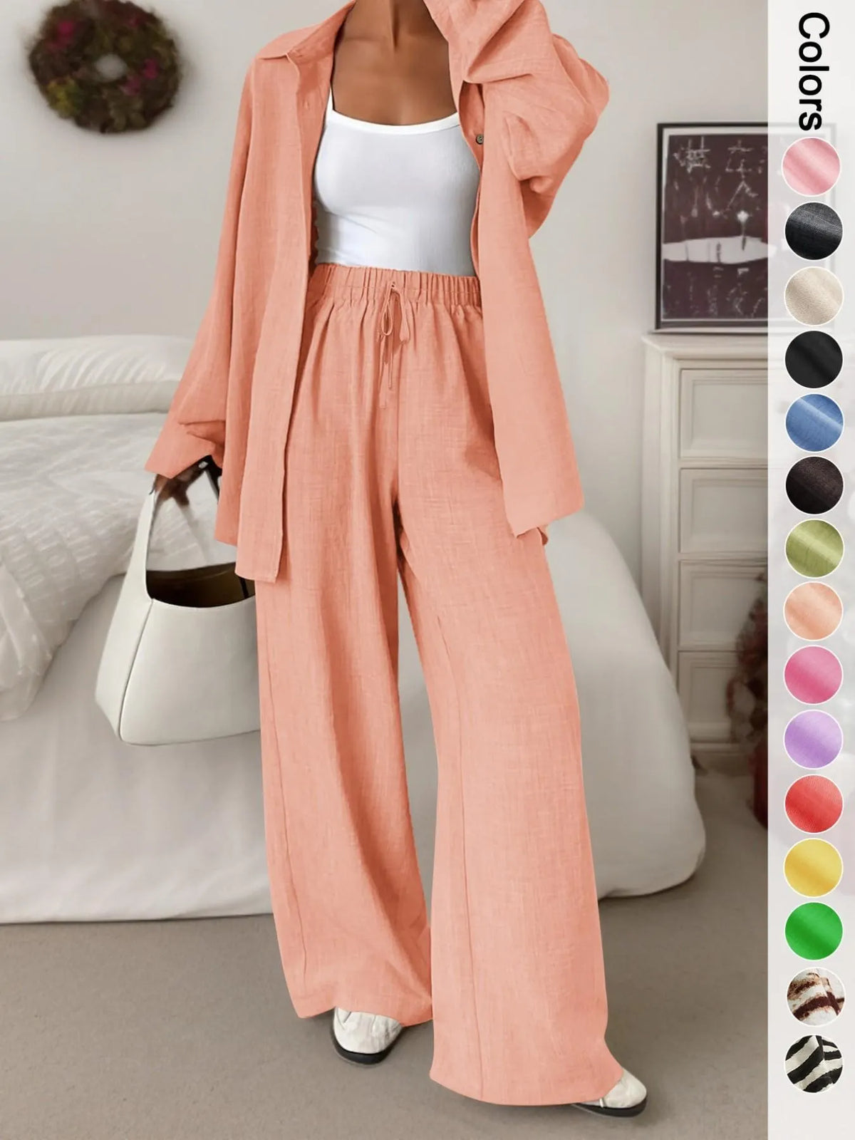 Women's casual athletic-style shirt and pants set—a two-piece ensemble featuring a loose-fitting button-down shirt and wide-leg pants, both comfortable and stylish