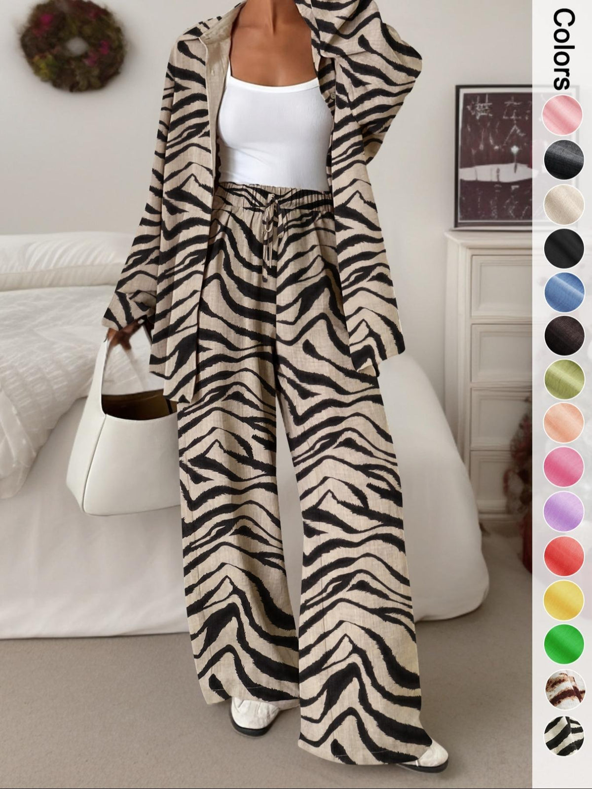 Women's casual athletic-style shirt and pants set—a two-piece ensemble featuring a loose-fitting button-down shirt and wide-leg pants, both comfortable and stylish