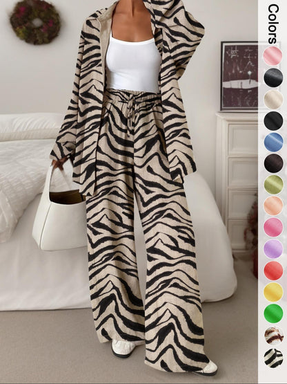 Women's casual athletic-style shirt and pants set—a two-piece ensemble featuring a loose-fitting button-down shirt and wide-leg pants, both comfortable and stylish