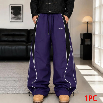 Men's high street style contrasting color splicing side striped tied wide-leg pants