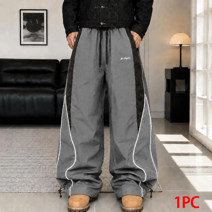 Men's high street style contrasting color splicing side striped tied wide-leg pants