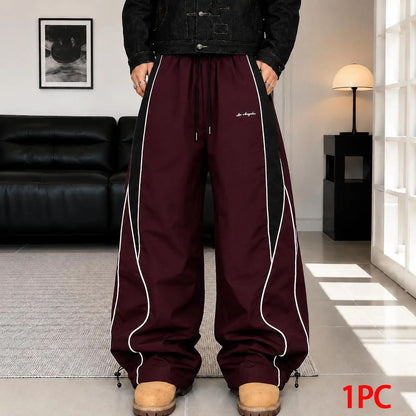 Men's high street style contrasting color splicing side striped tied wide-leg pants