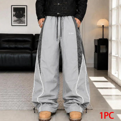 Men's high street style contrasting color splicing side striped tied wide-leg pants