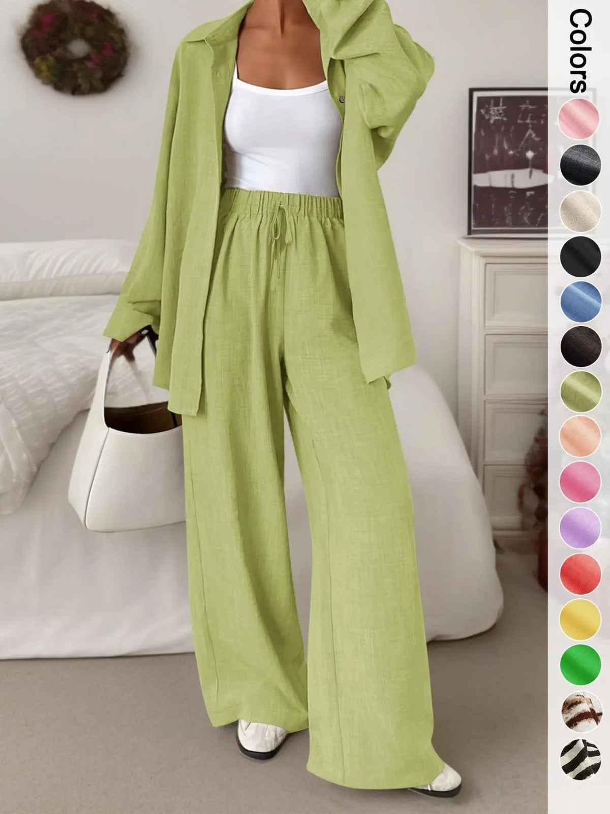 Women's casual athletic-style shirt and pants set—a two-piece ensemble featuring a loose-fitting button-down shirt and wide-leg pants, both comfortable and stylish