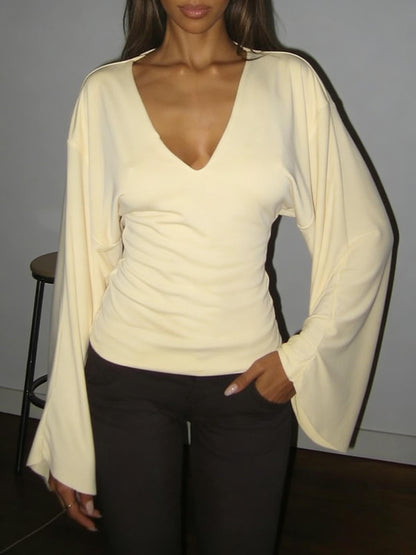 Elegant women's solid-color long-sleeved T-shirt, featuring a sexy deep V-neck and a slim-fit design
