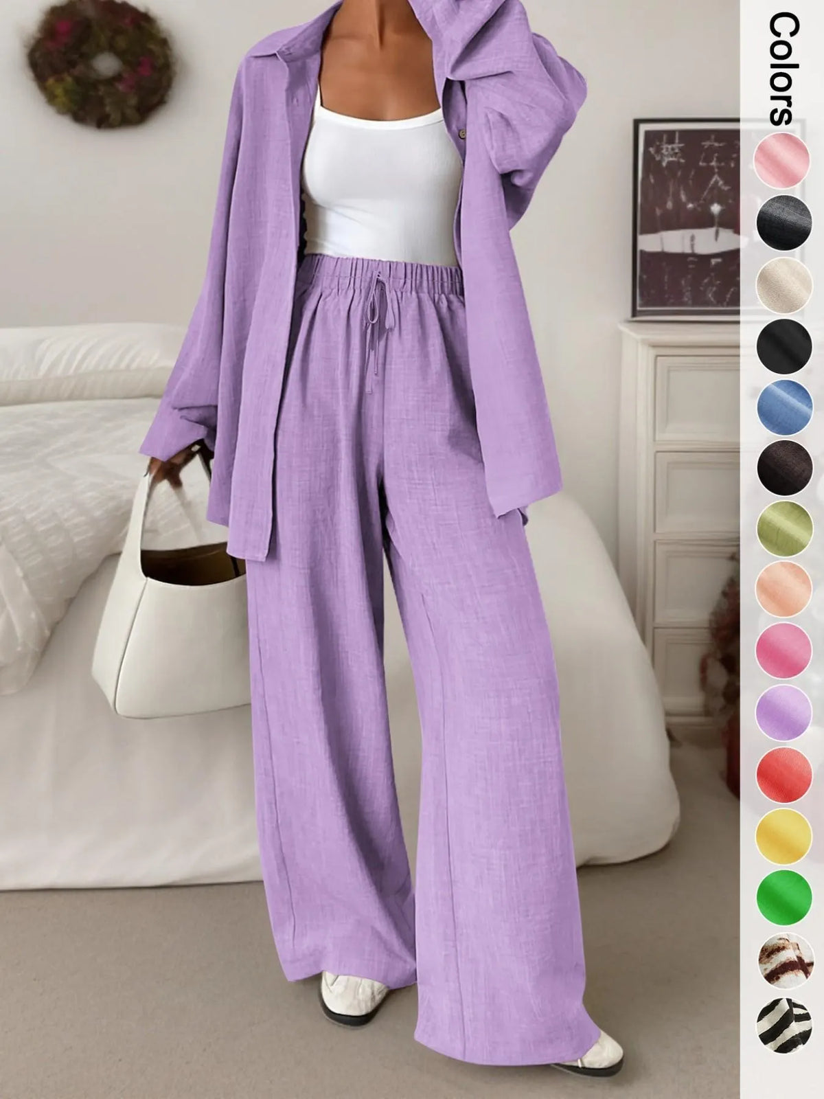 Women's casual athletic-style shirt and pants set—a two-piece ensemble featuring a loose-fitting button-down shirt and wide-leg pants, both comfortable and stylish